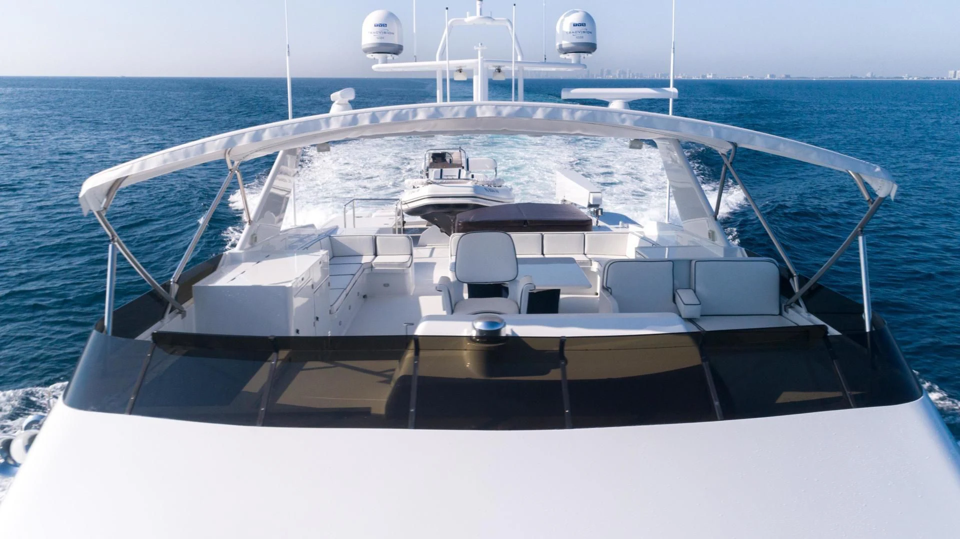 a white boat on the water aboard WELL DONE Yacht for Sale