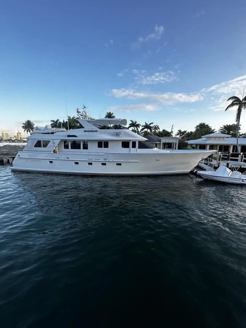 a couple of boats in the water aboard WELL DONE Yacht for Sale