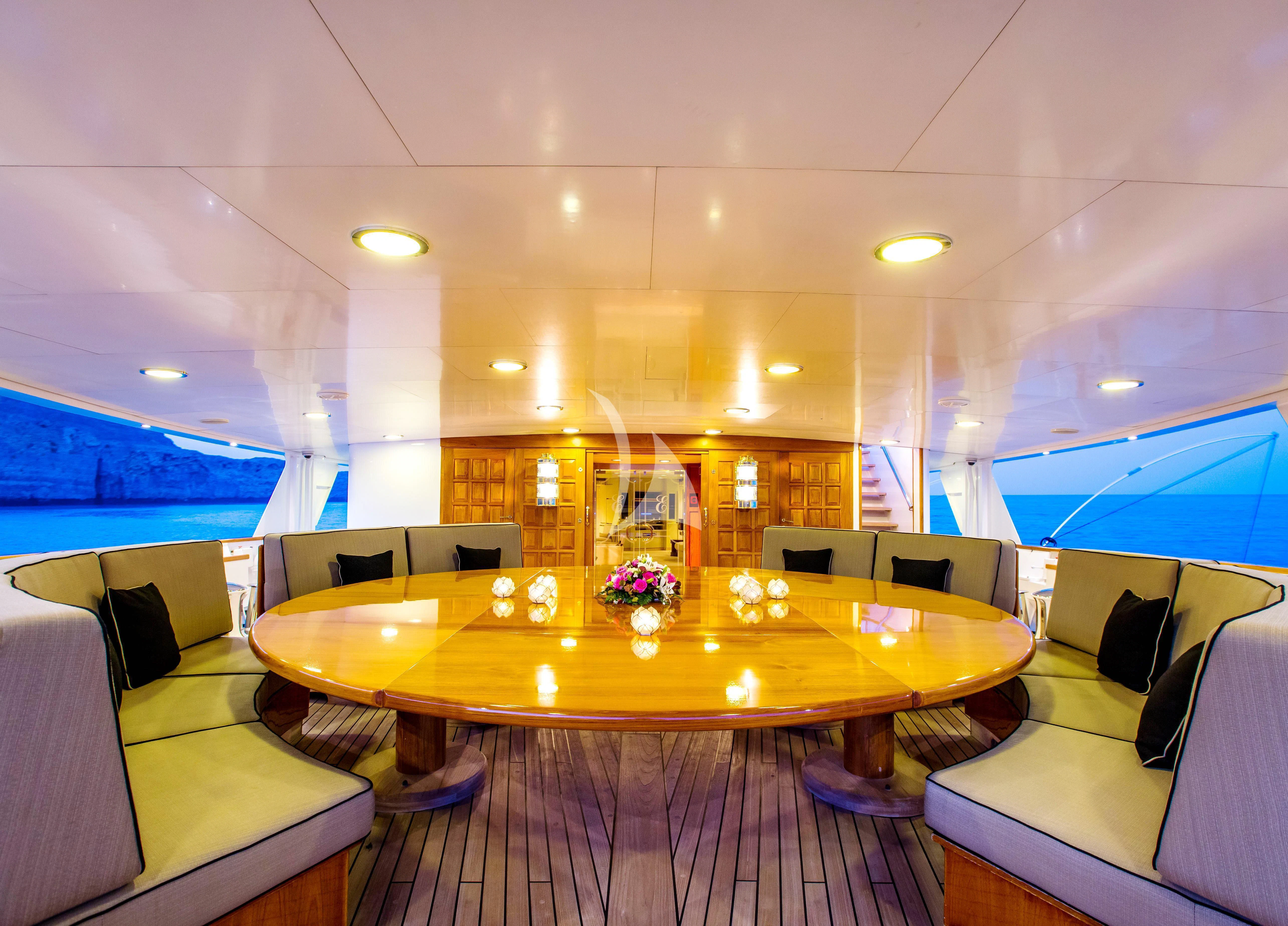a room with a table and chairs aboard ESMERALDA Yacht for Sale
