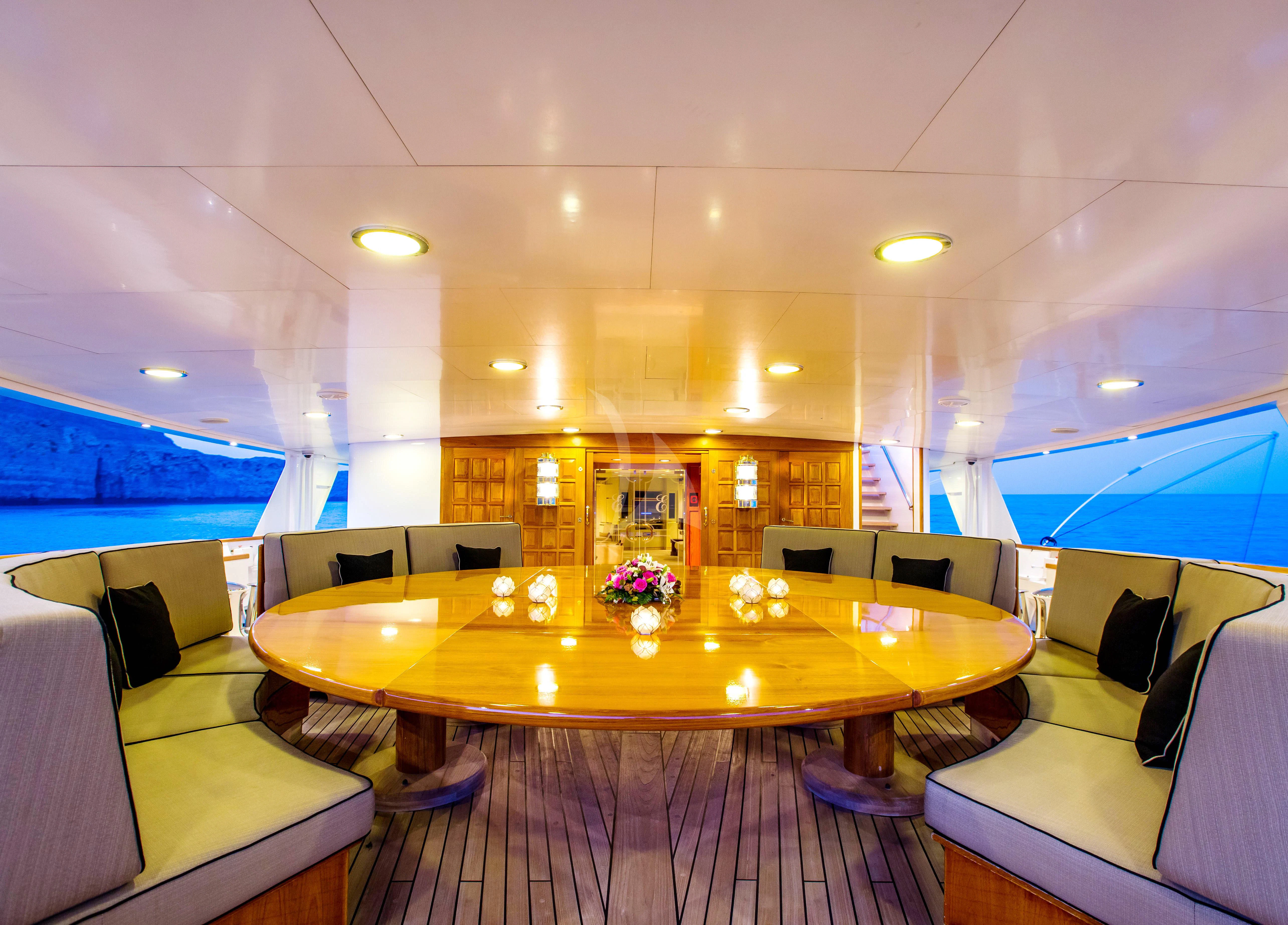 a room with a table and chairs aboard ESMERALDA Yacht for Sale