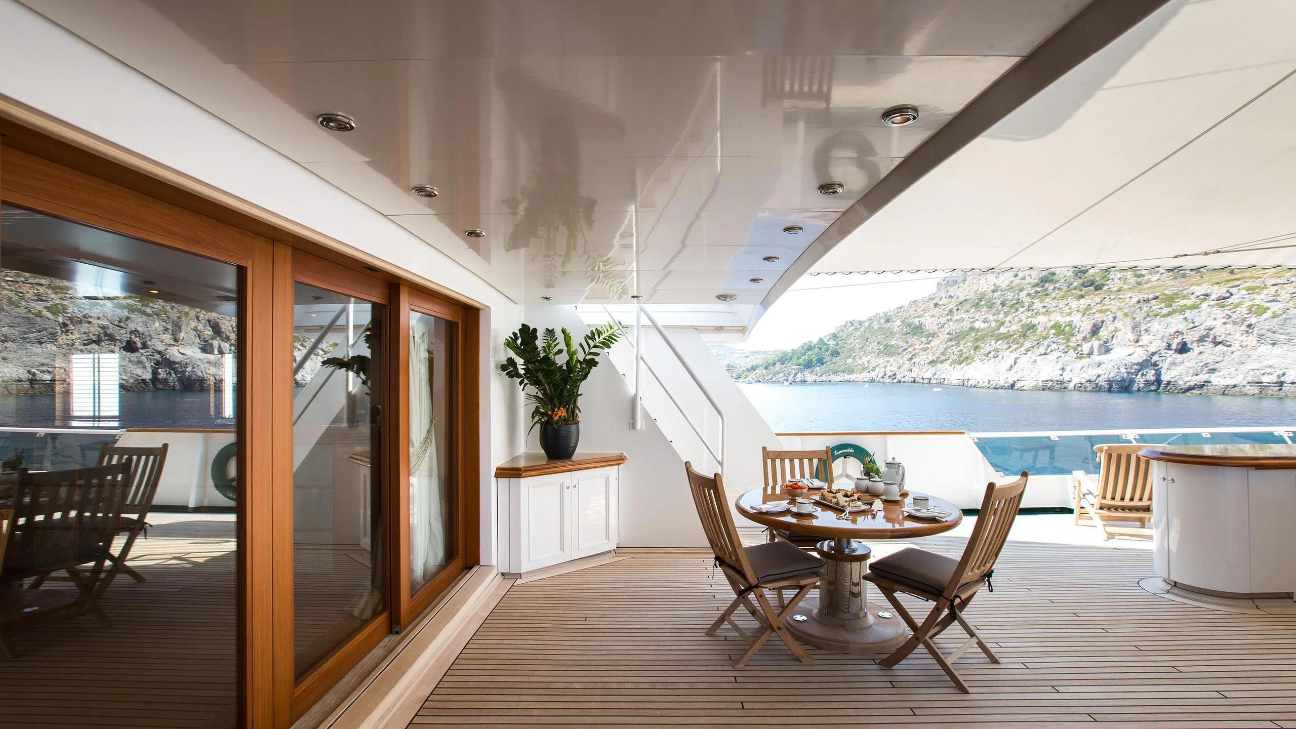 a room with a table and chairs aboard ESMERALDA Yacht for Sale