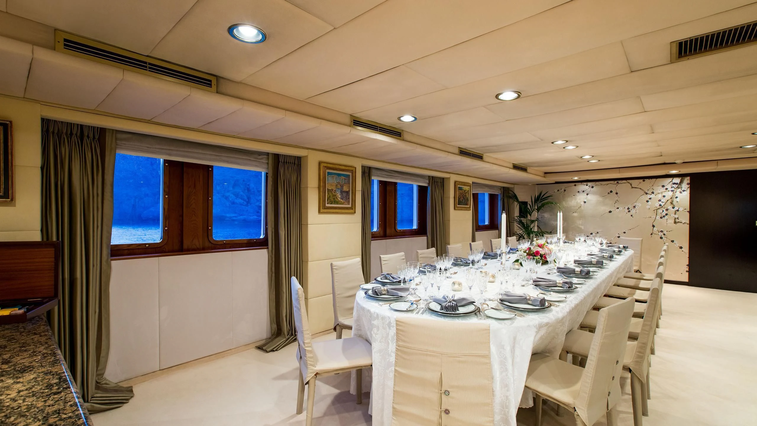 a conference room with a table and chairs aboard ESMERALDA Yacht for Sale