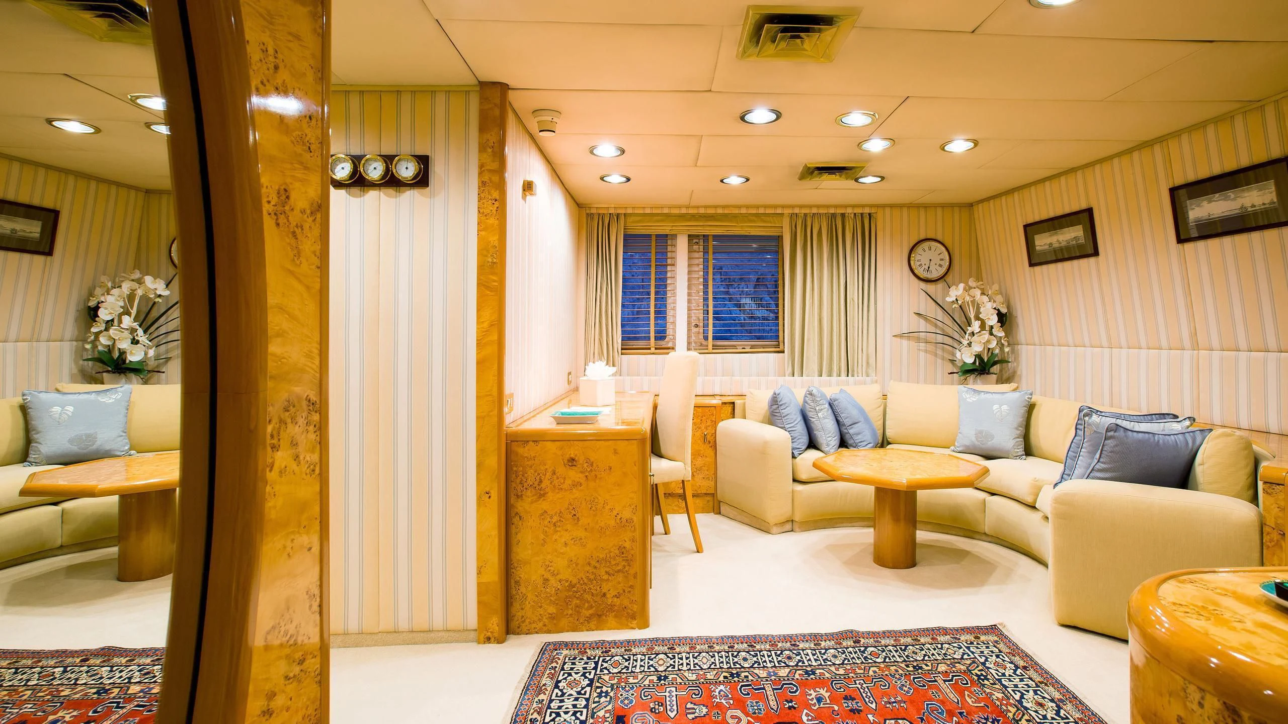a living room with a couch and a table aboard ESMERALDA Yacht for Sale