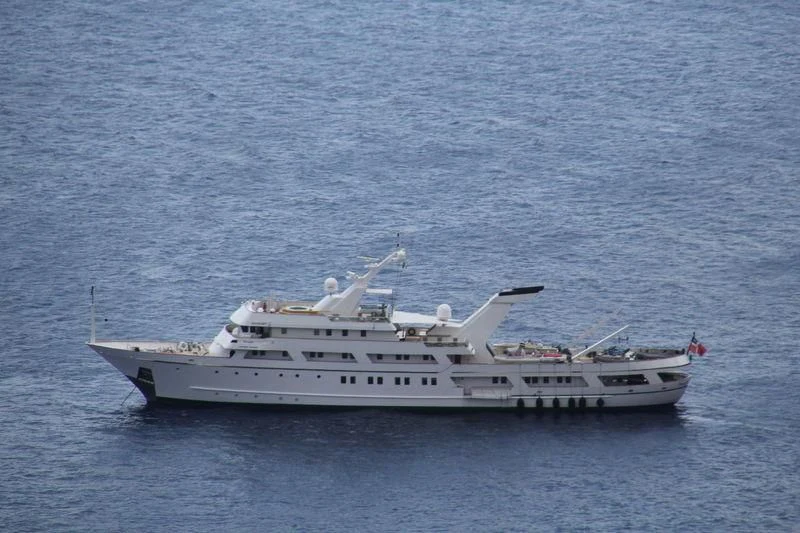 a white yacht in the water aboard ESMERALDA Yacht for Sale
