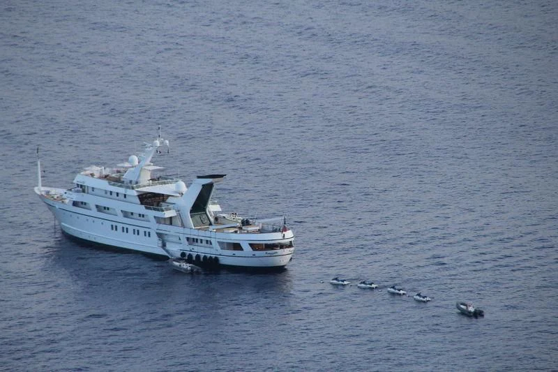 a boat in the water aboard ESMERALDA Yacht for Sale