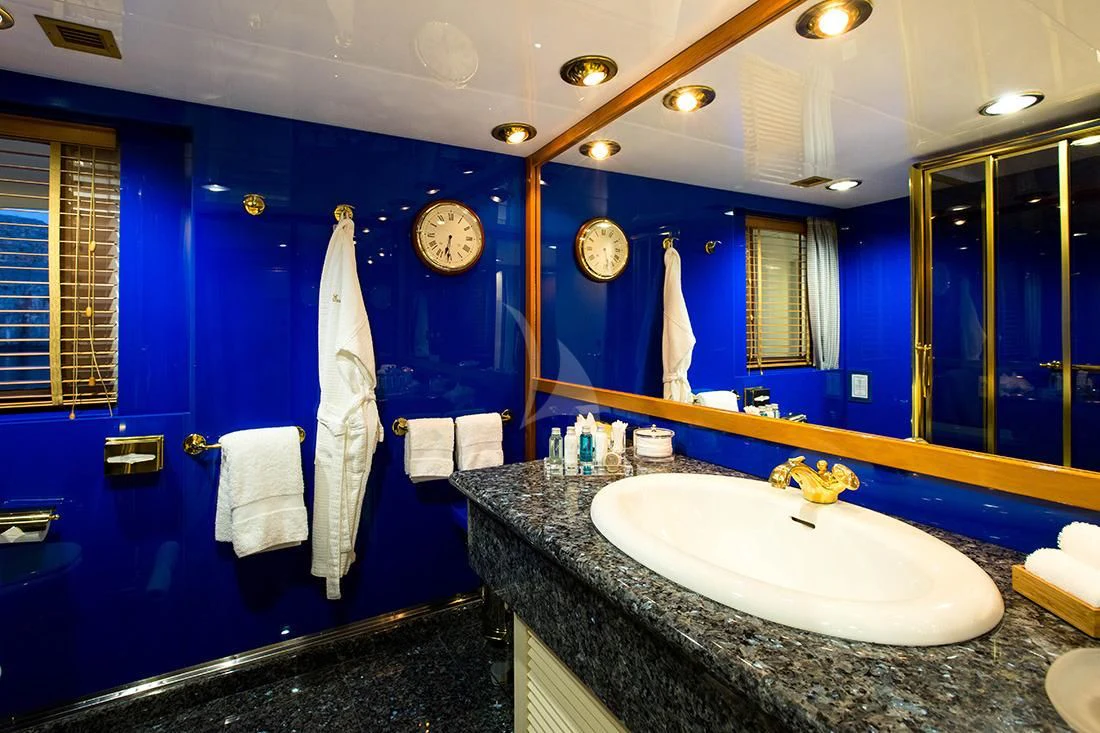 a bathroom with a large mirror aboard ESMERALDA Yacht for Sale