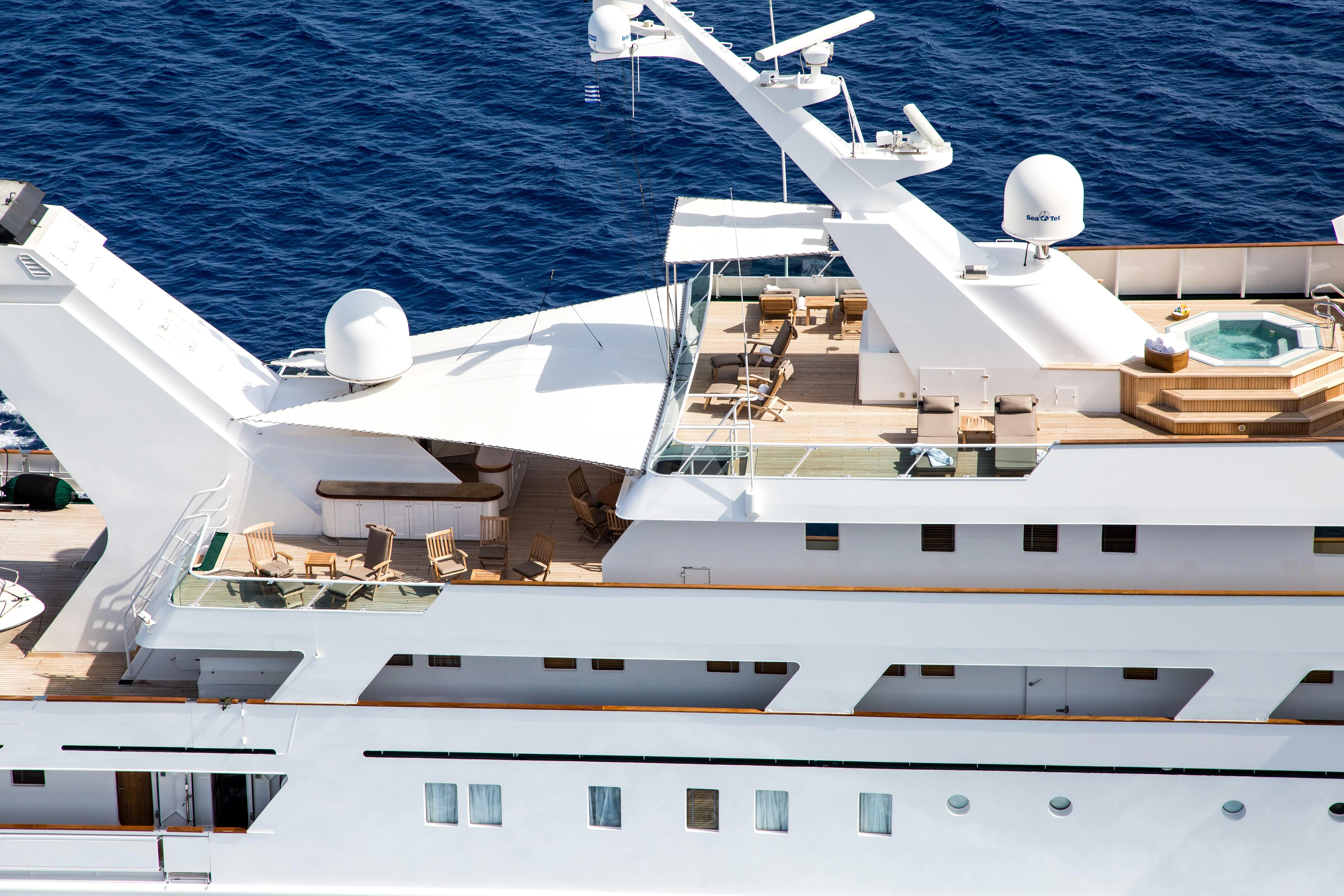 a white yacht on the water aboard ESMERALDA Yacht for Sale