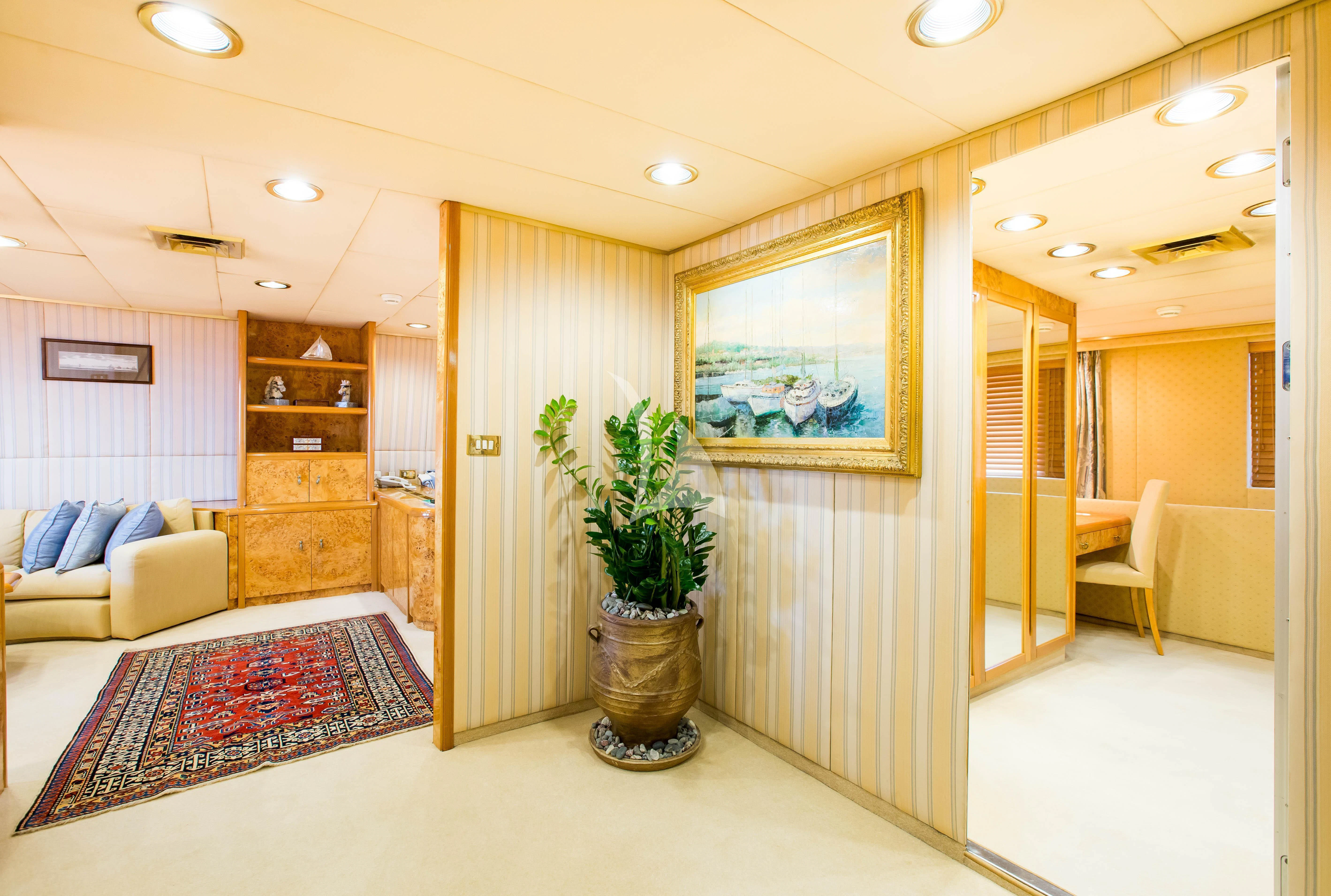 a living room with a plant in a pot aboard ESMERALDA Yacht for Sale