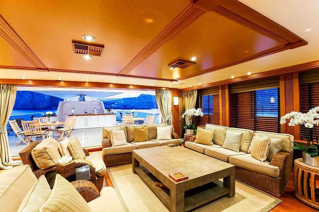 a living room with a large swimming pool aboard ESMERALDA Yacht for Sale