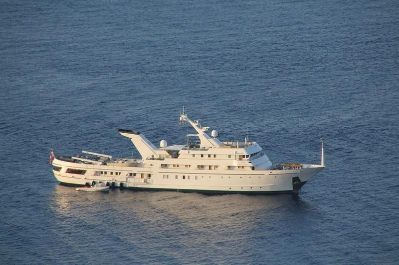 a large white boat in the water aboard ESMERALDA Yacht for Sale