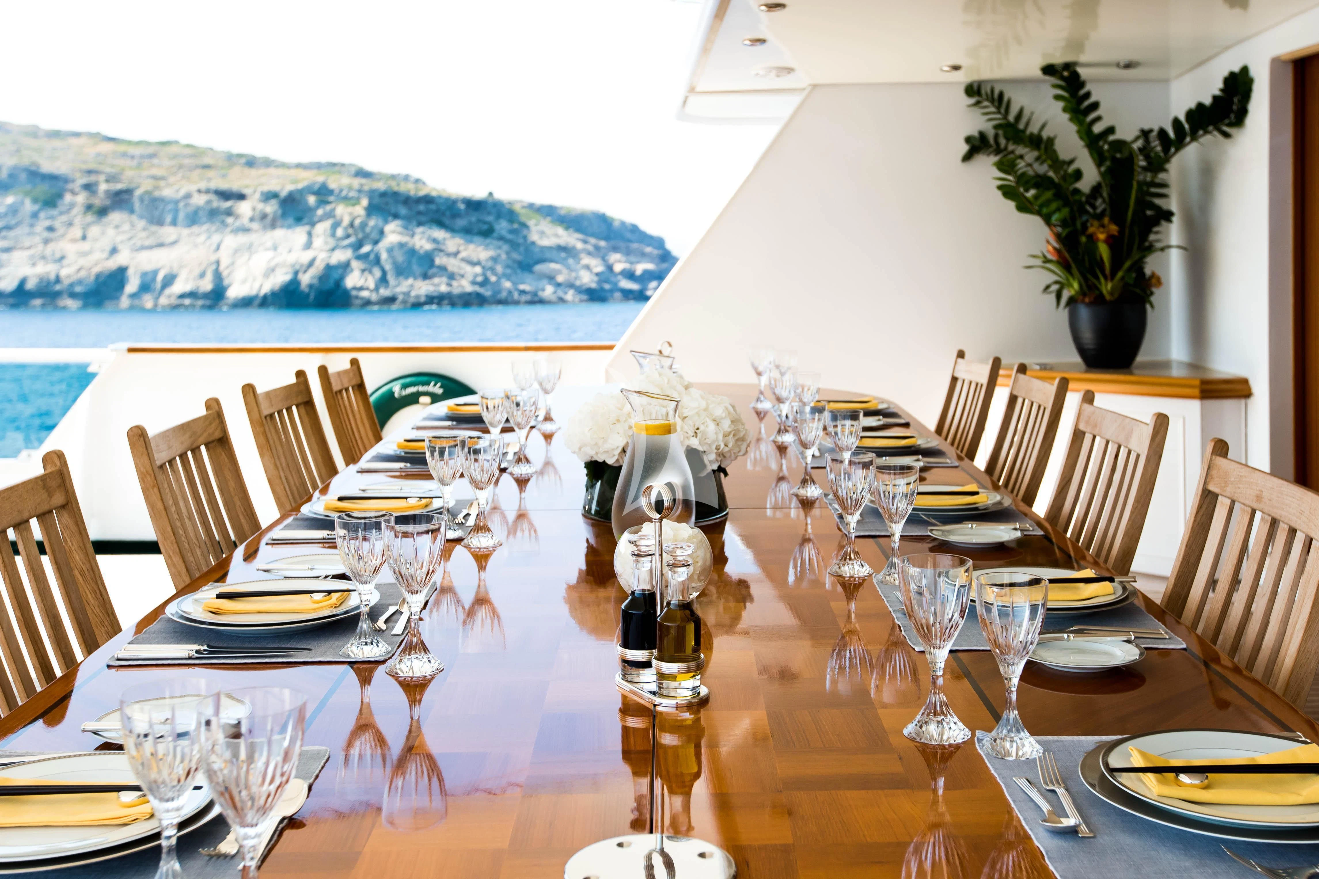a table set for a dinner aboard ESMERALDA Yacht for Sale