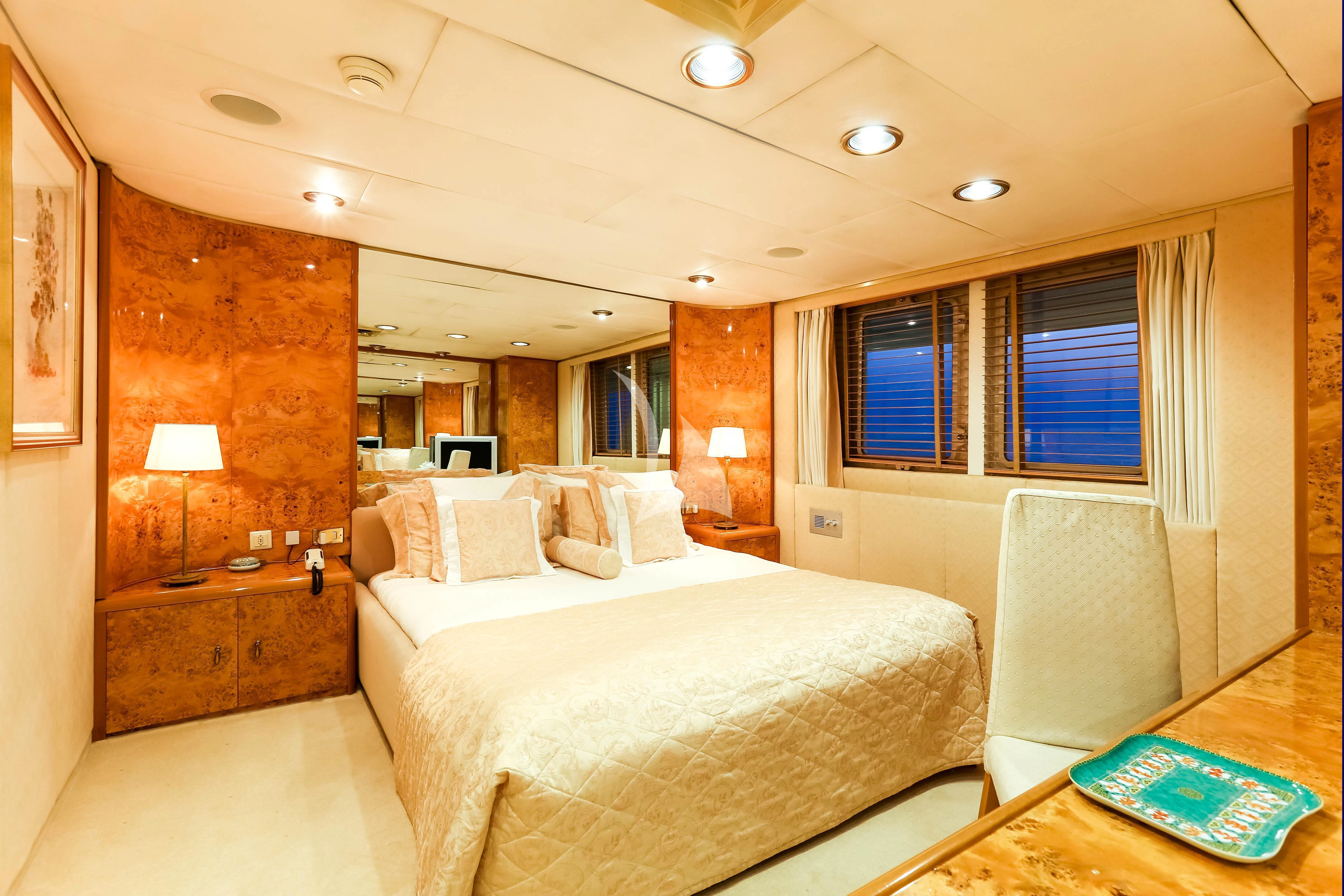 a room with a bed and a desk aboard ESMERALDA Yacht for Sale