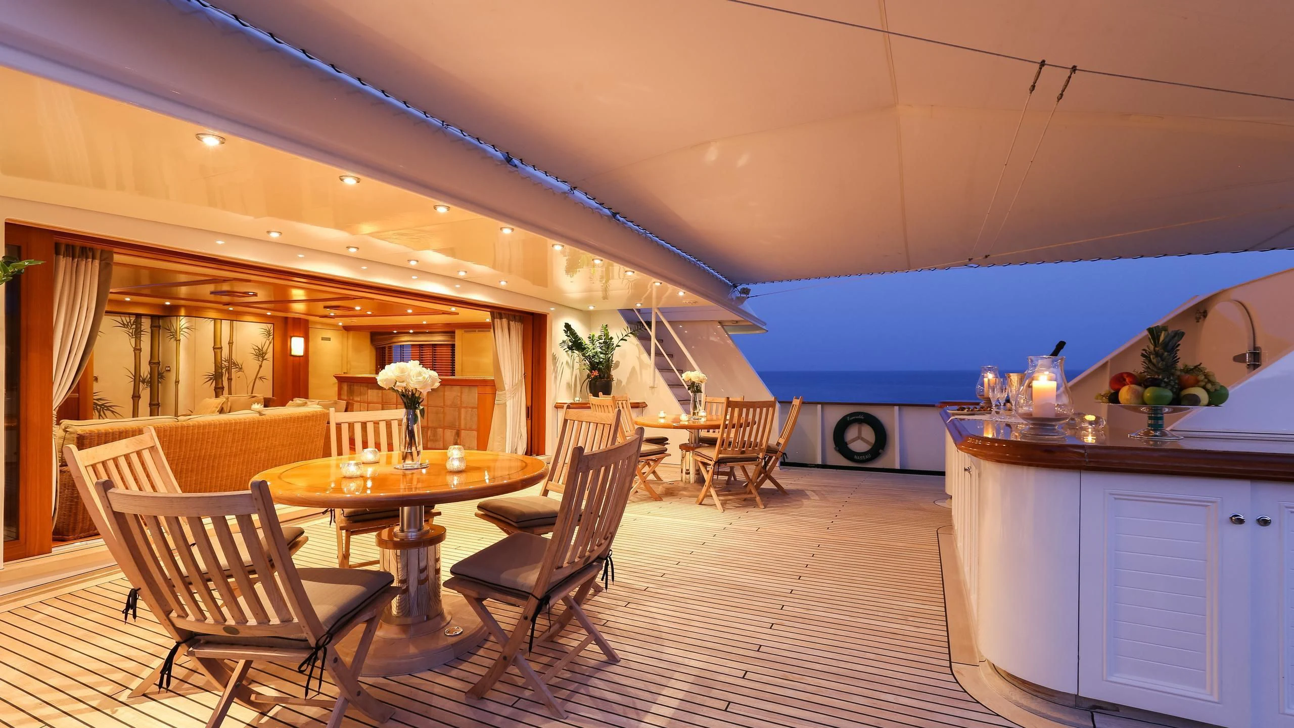 a large room with a table and chairs aboard ESMERALDA Yacht for Sale