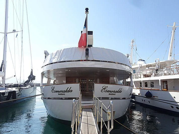 a boat docked at a pier aboard ESMERALDA Yacht for Sale