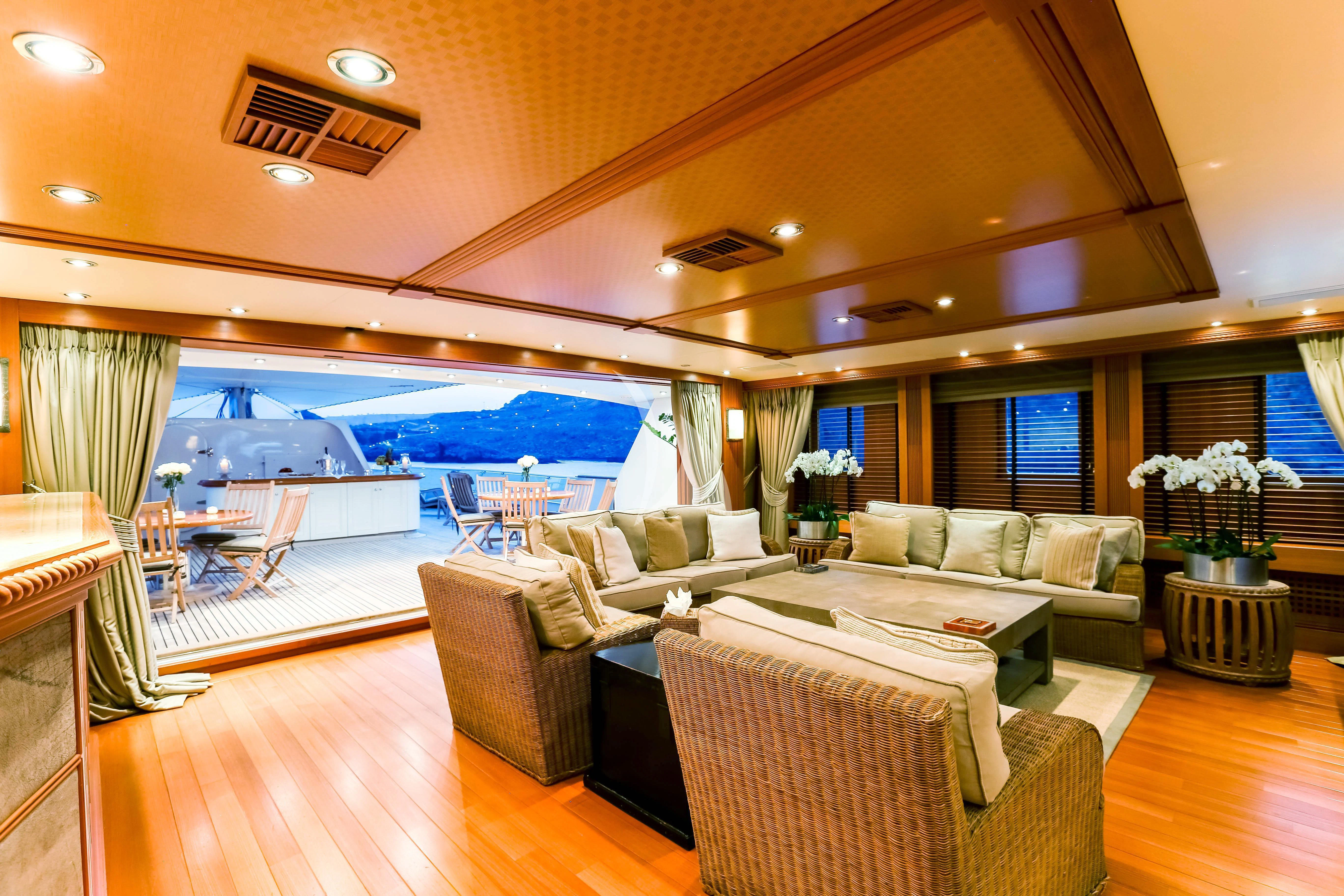 a living room with a large window aboard ESMERALDA Yacht for Sale