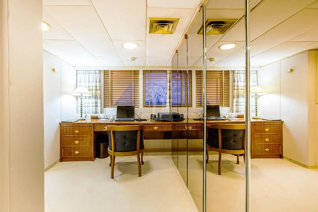 a room with a desk and a chair aboard ESMERALDA Yacht for Sale