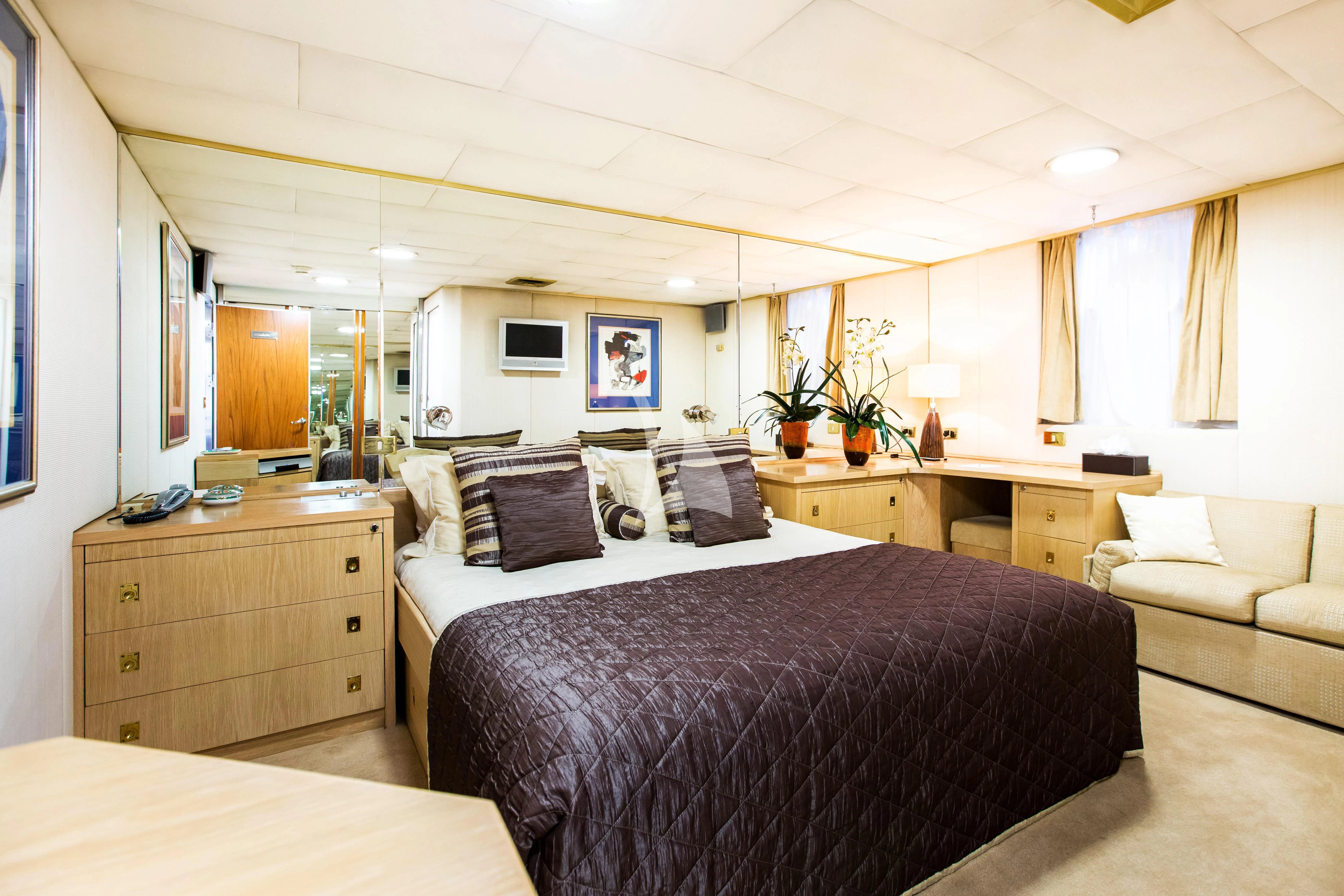 a bedroom with two beds aboard ESMERALDA Yacht for Sale