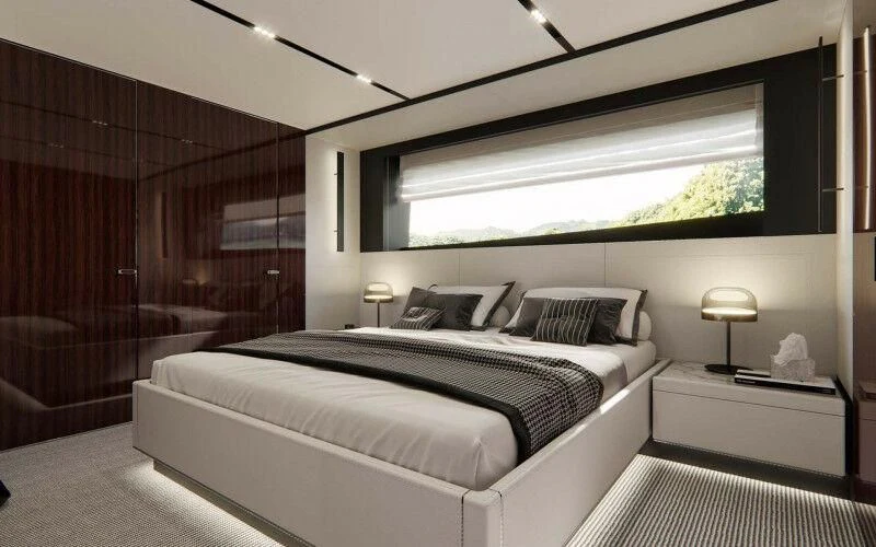 a room with a bed and a window aboard SEVEN Yacht for Sale