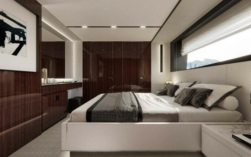 a room with a bed and a desk aboard SEVEN Yacht for Sale