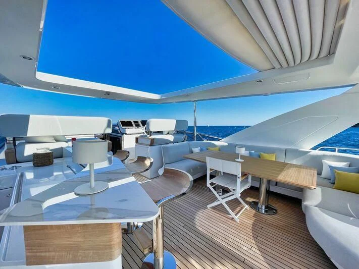 a boat with tables and chairs aboard WAVE Yacht for Sale
