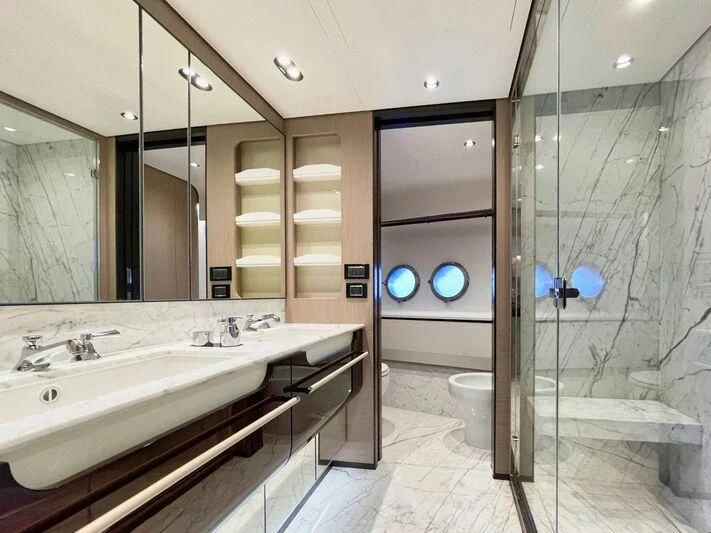 a bathroom with a glass shower aboard WAVE Yacht for Sale