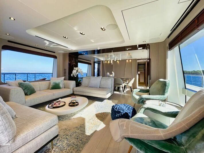a living room with a large window aboard WAVE Yacht for Sale