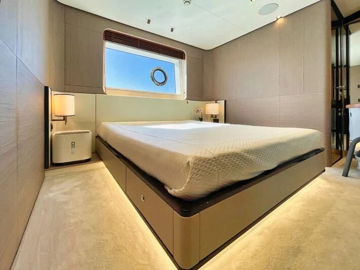 a large bed in a room aboard WAVE Yacht for Sale