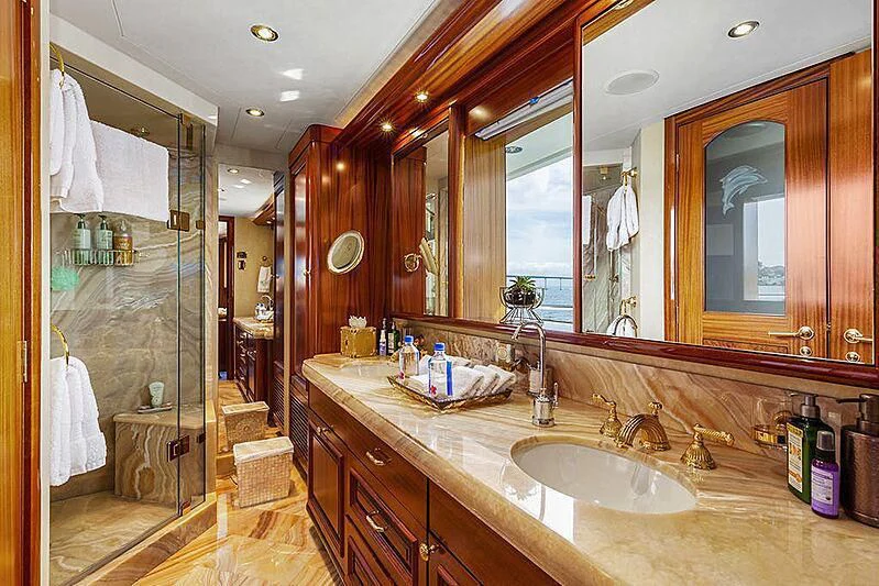 a bathroom with a large mirror aboard DELUSHA Yacht for Sale