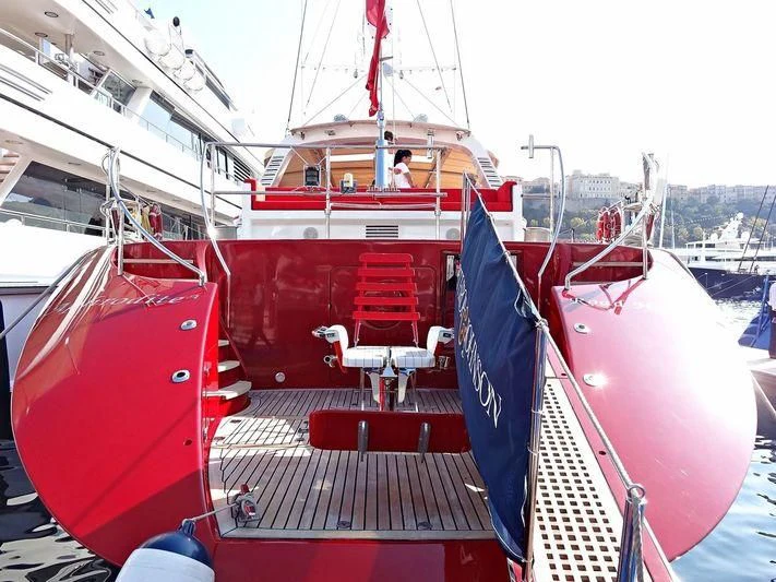 a boat with a blue and red canopy aboard DELUSHA Yacht for Sale