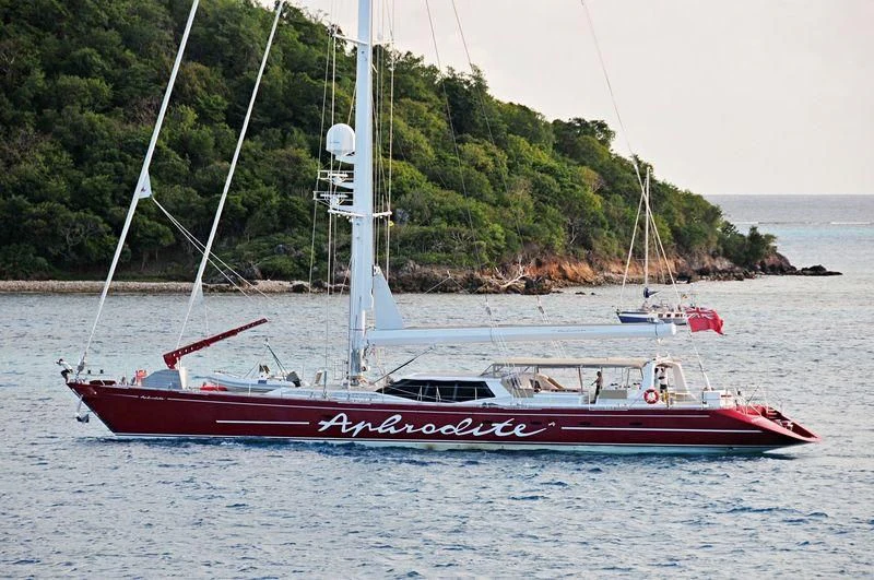 a red and white boat in the water aboard DELUSHA Yacht for Sale