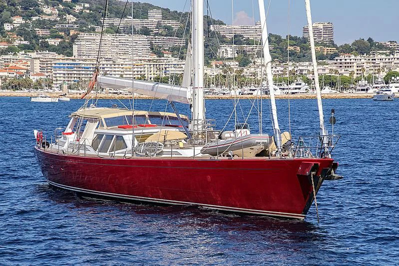 a red boat in the water aboard DELUSHA Yacht for Sale