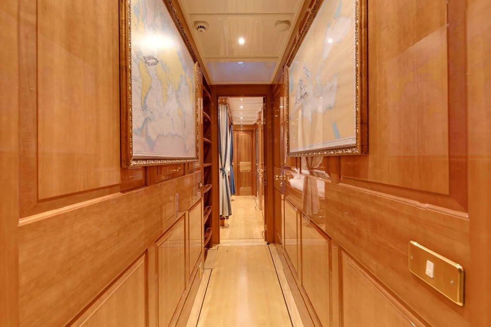 a hallway with wooden cabinets aboard DELUSHA Yacht for Sale