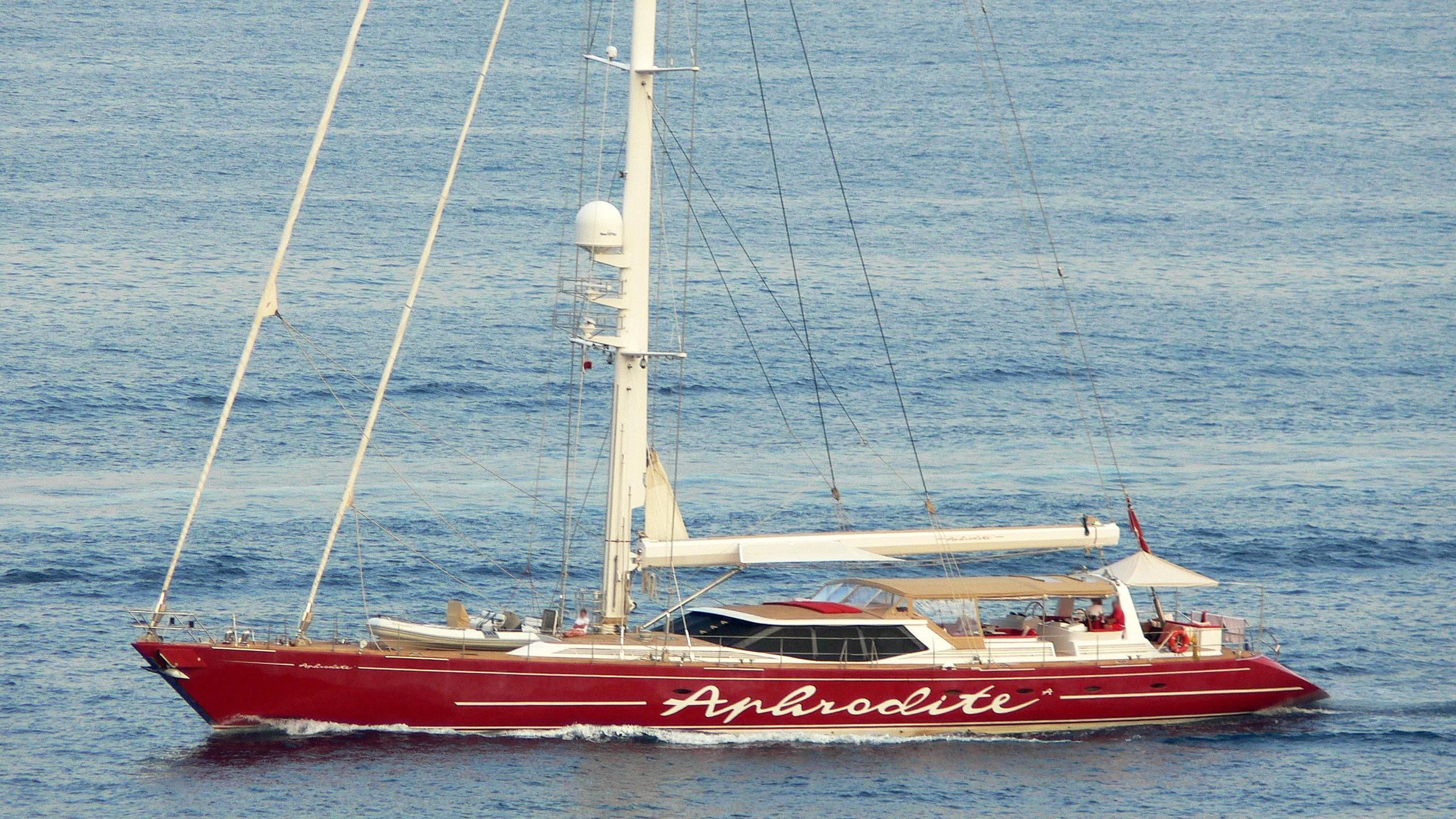 a red boat in the water aboard DELUSHA Yacht for Sale
