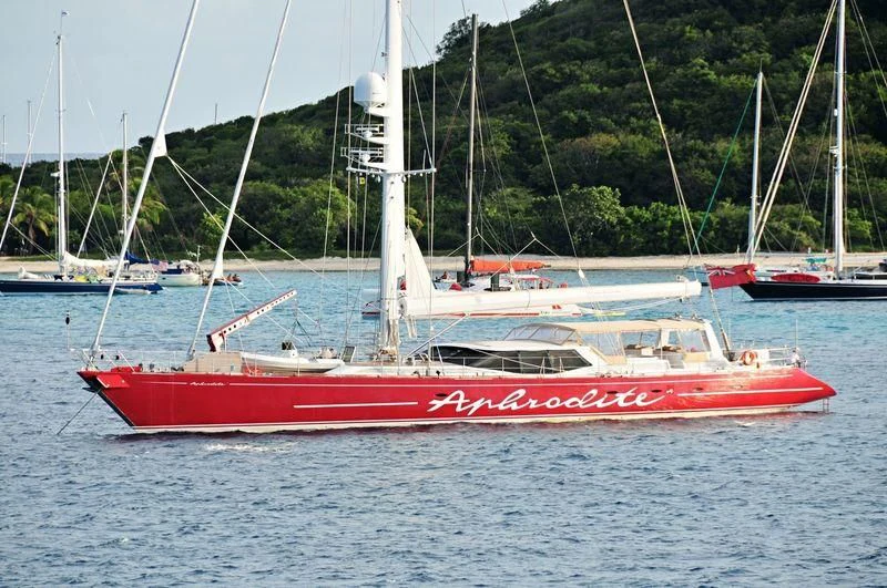 a red and white boat in the water aboard DELUSHA Yacht for Sale
