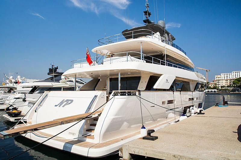 a boat docked at a pier aboard NP Yacht for Sale