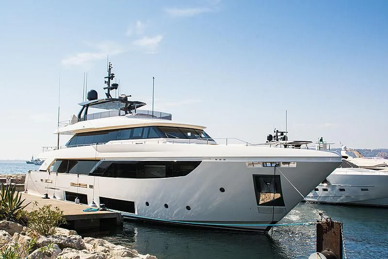 a white yacht docked aboard NP Yacht for Sale