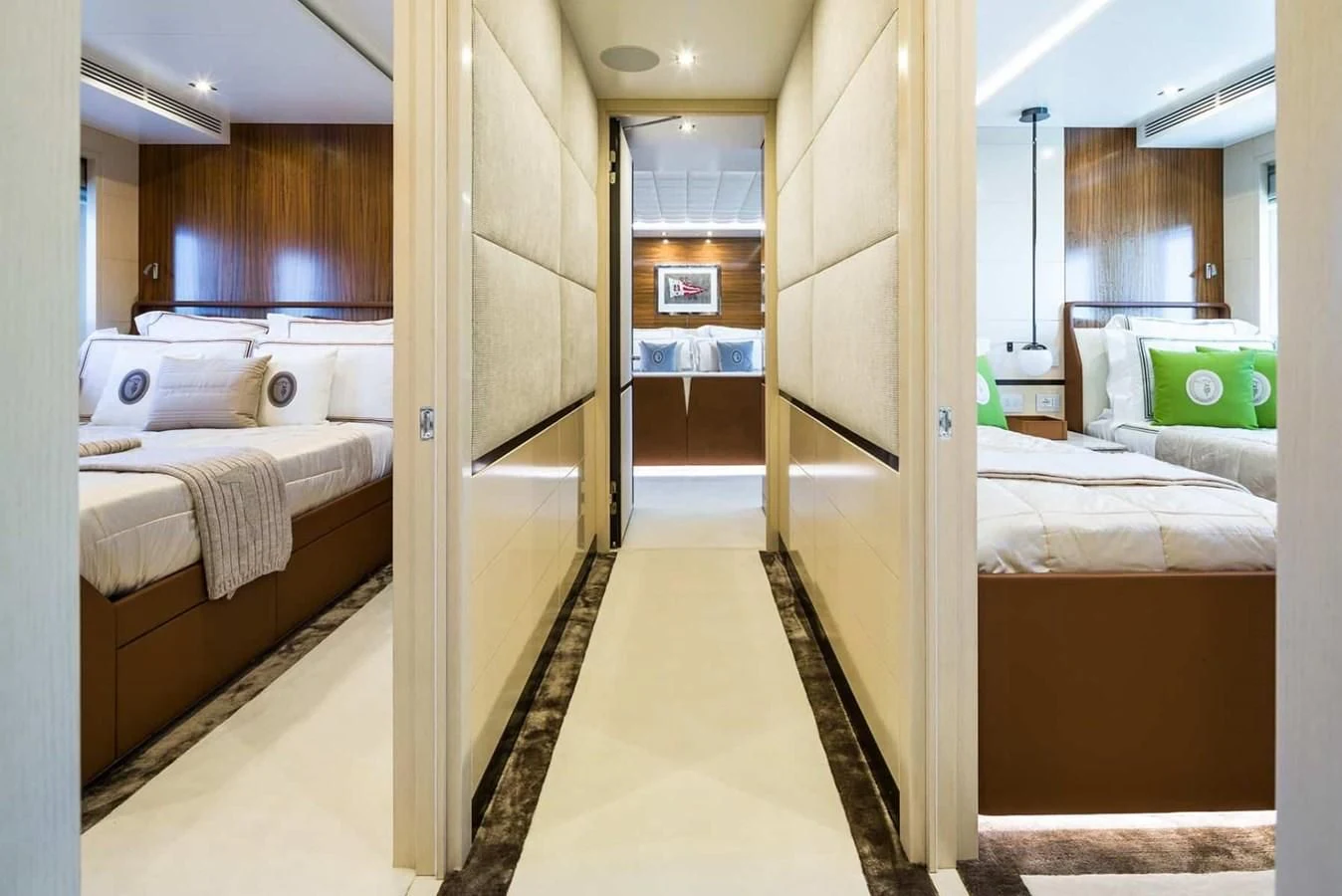 a room with a bed and a mirror aboard GTT 130 Yacht for Sale