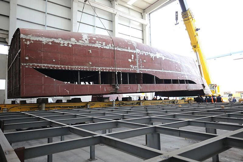a large red container with a crane aboard FAMILIA Yacht for Sale