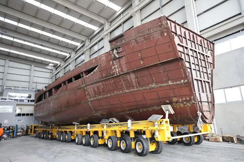a large truck with a large load aboard FAMILIA Yacht for Sale