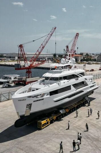 a large white boat with a crane on the deck aboard FAMILIA Yacht for Sale