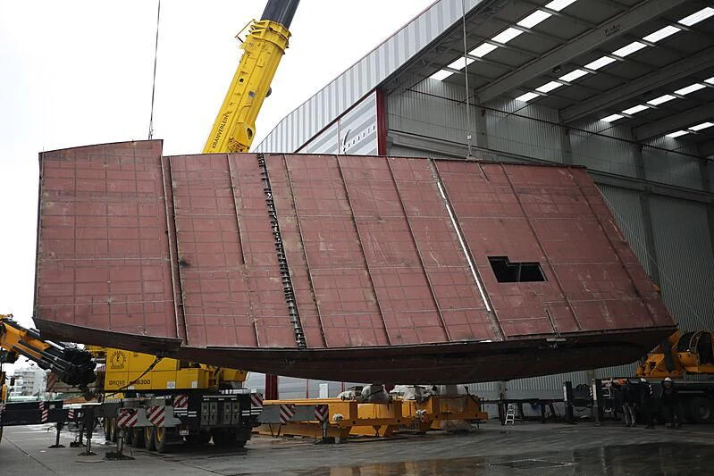 a large red container with a crane aboard FAMILIA Yacht for Sale