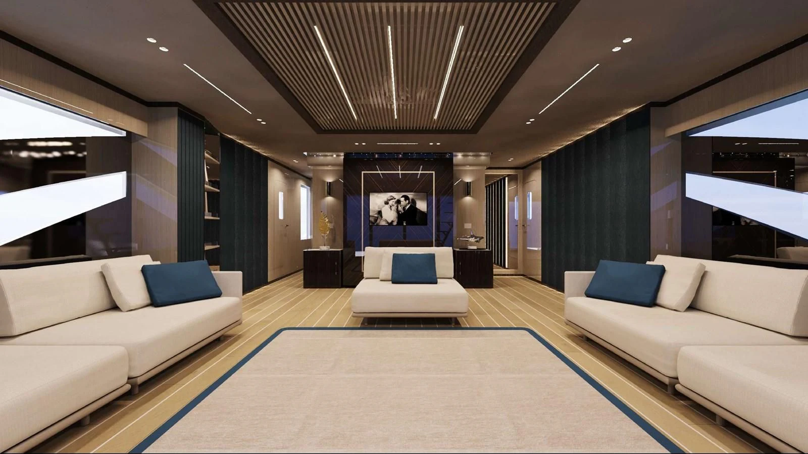 a large living room with a large blue rug aboard FAMILIA Yacht for Sale