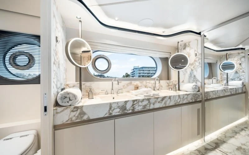a bathroom with a large mirror aboard GAS Yacht for Sale
