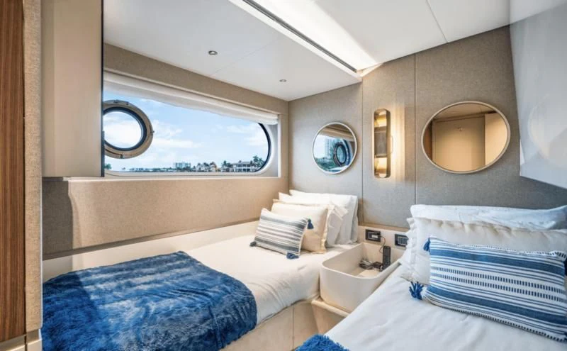 a room with two beds aboard GAS Yacht for Sale
