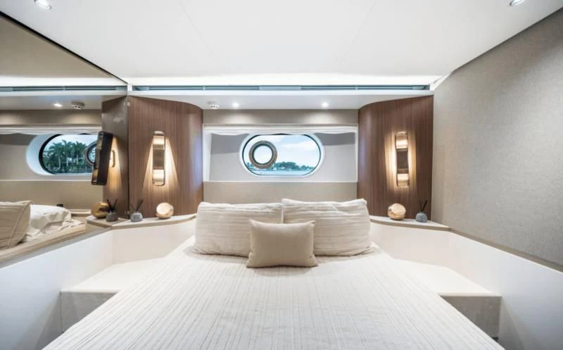 a large bed with white sheets aboard GAS Yacht for Sale
