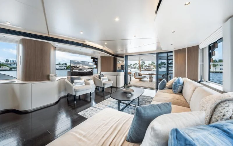 a living room with a large glass door aboard GAS Yacht for Sale