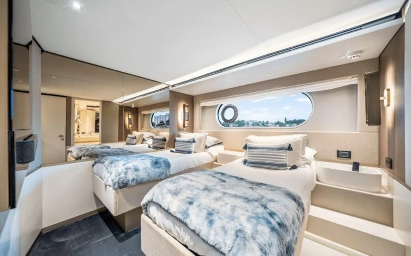 a room with several beds aboard GAS Yacht for Sale