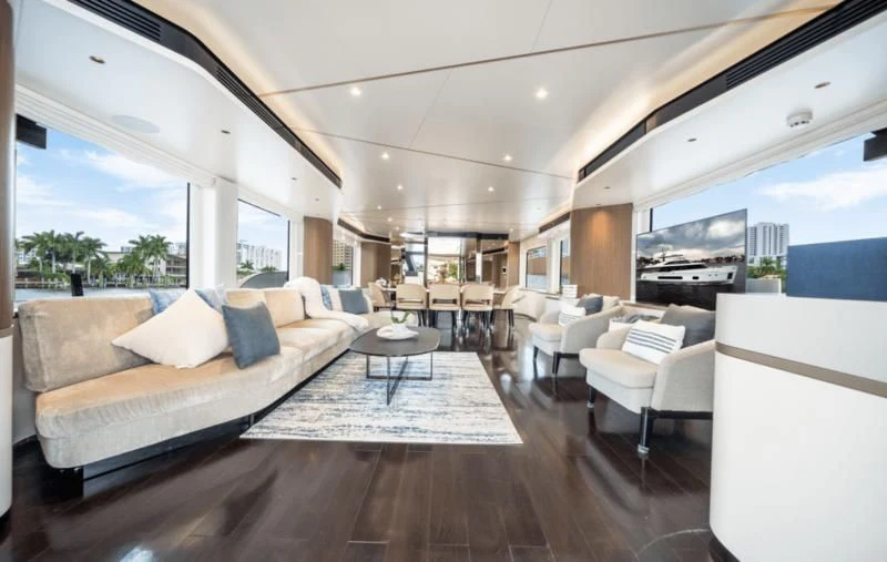 a living room with a large screen aboard GAS Yacht for Sale