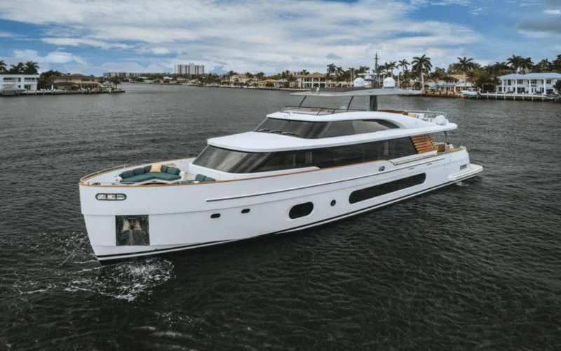 a white boat on the water aboard GAS Yacht for Sale