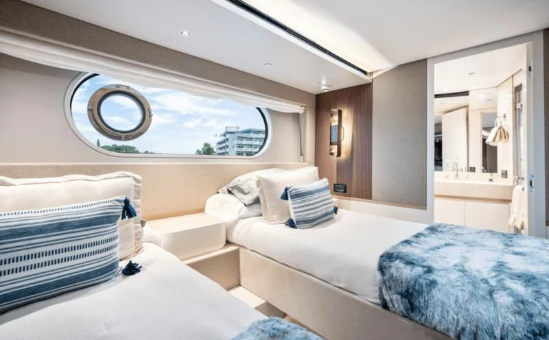 a room with two beds aboard GAS Yacht for Sale